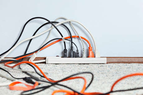 multiple wires plugged into surge protector