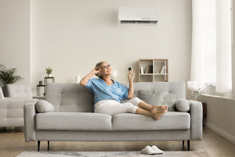 woman relaxing in her cool living room