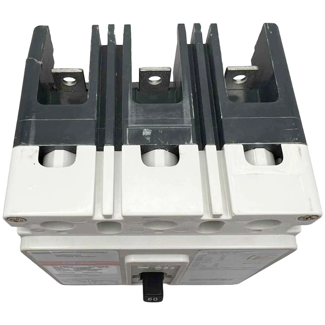 Electrical component with metallic and plastic parts on a white background