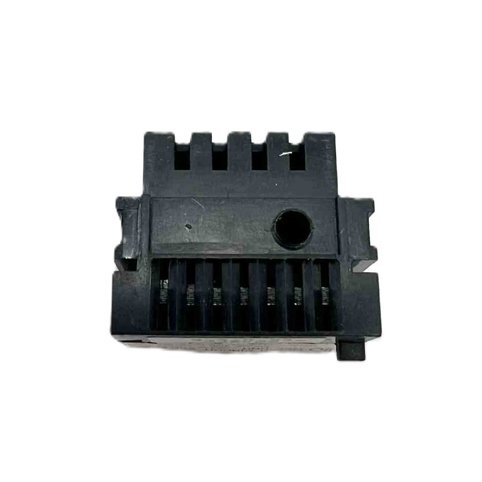 Black plastic component on a white background