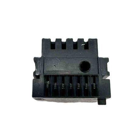 Black plastic component on a white background