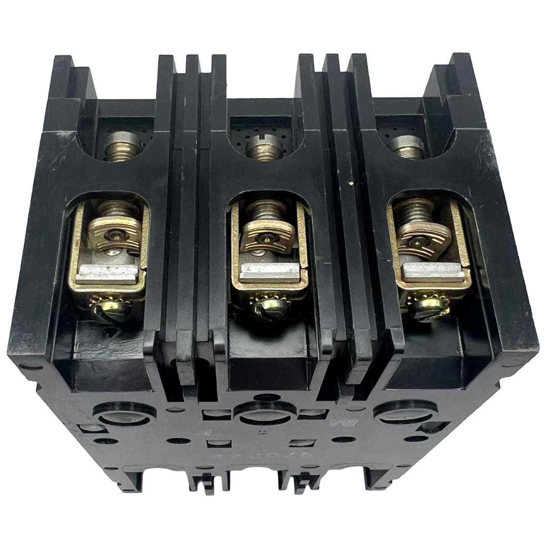 Black electrical circuit breaker with brass contacts on a white background