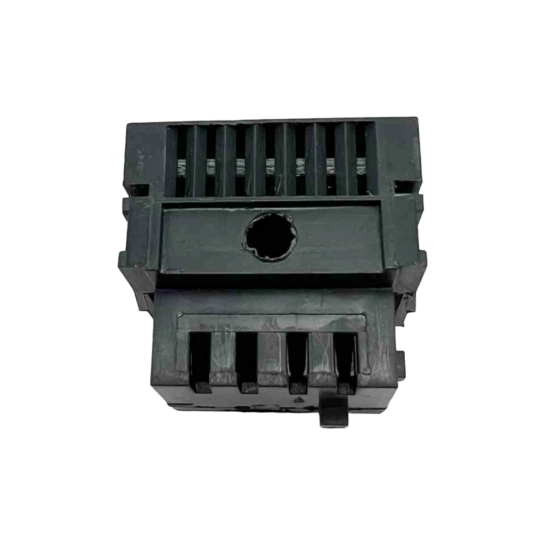 Black plastic component on a white background