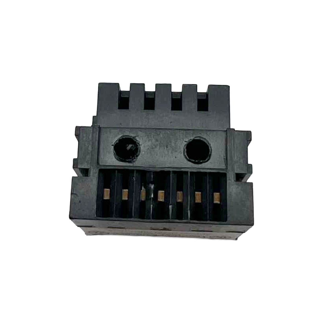 Black plastic component with grooves on a white background