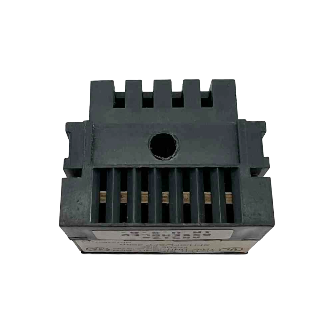 Black electronic component with cooling fins on a white background