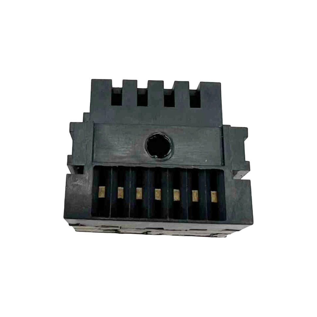 Black plastic component with grooves on a white background