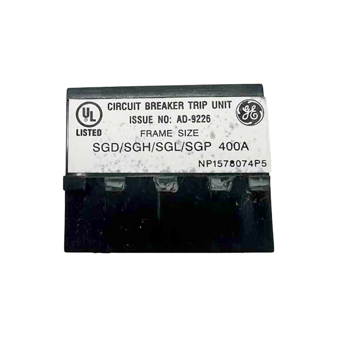 Circuit breaker trip unit with GE branding on a white background