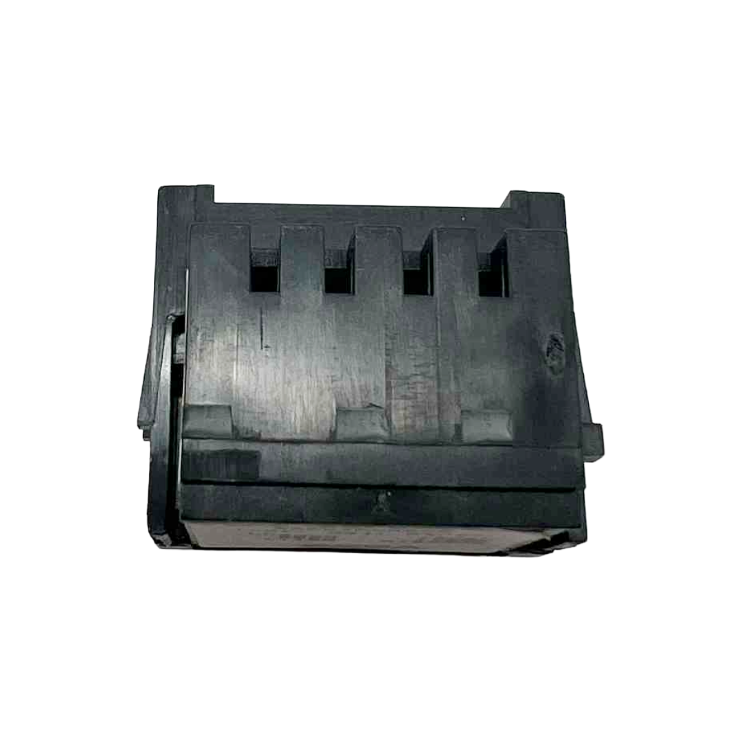 Black plastic component on a white background