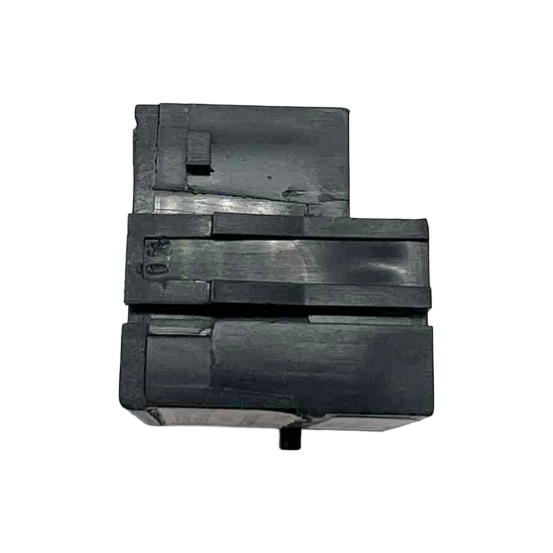 Three black rubber blocks stacked on a white background