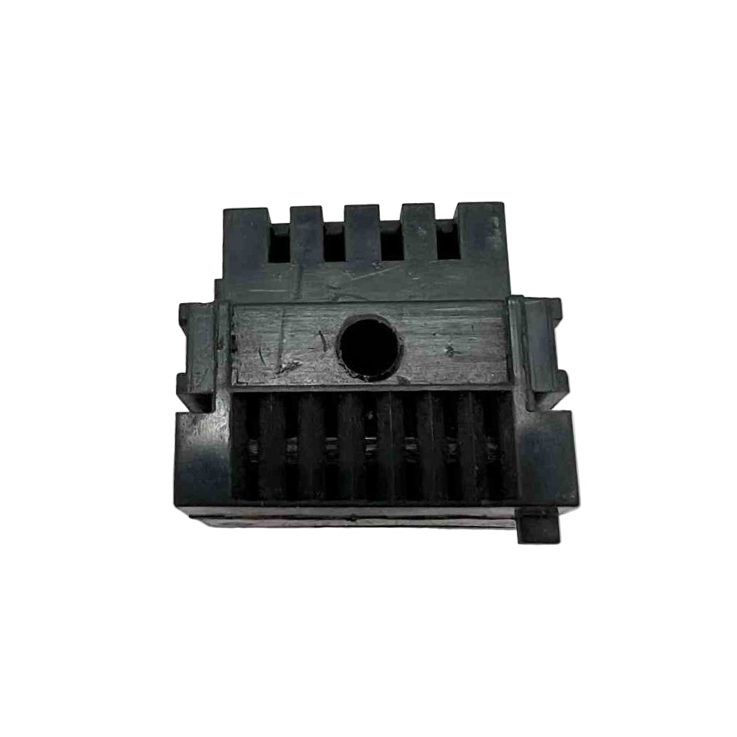 Black plastic component with grooves on a white background