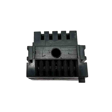 Black plastic component with grooves on a white background