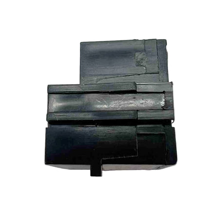 Black plastic component on a white background