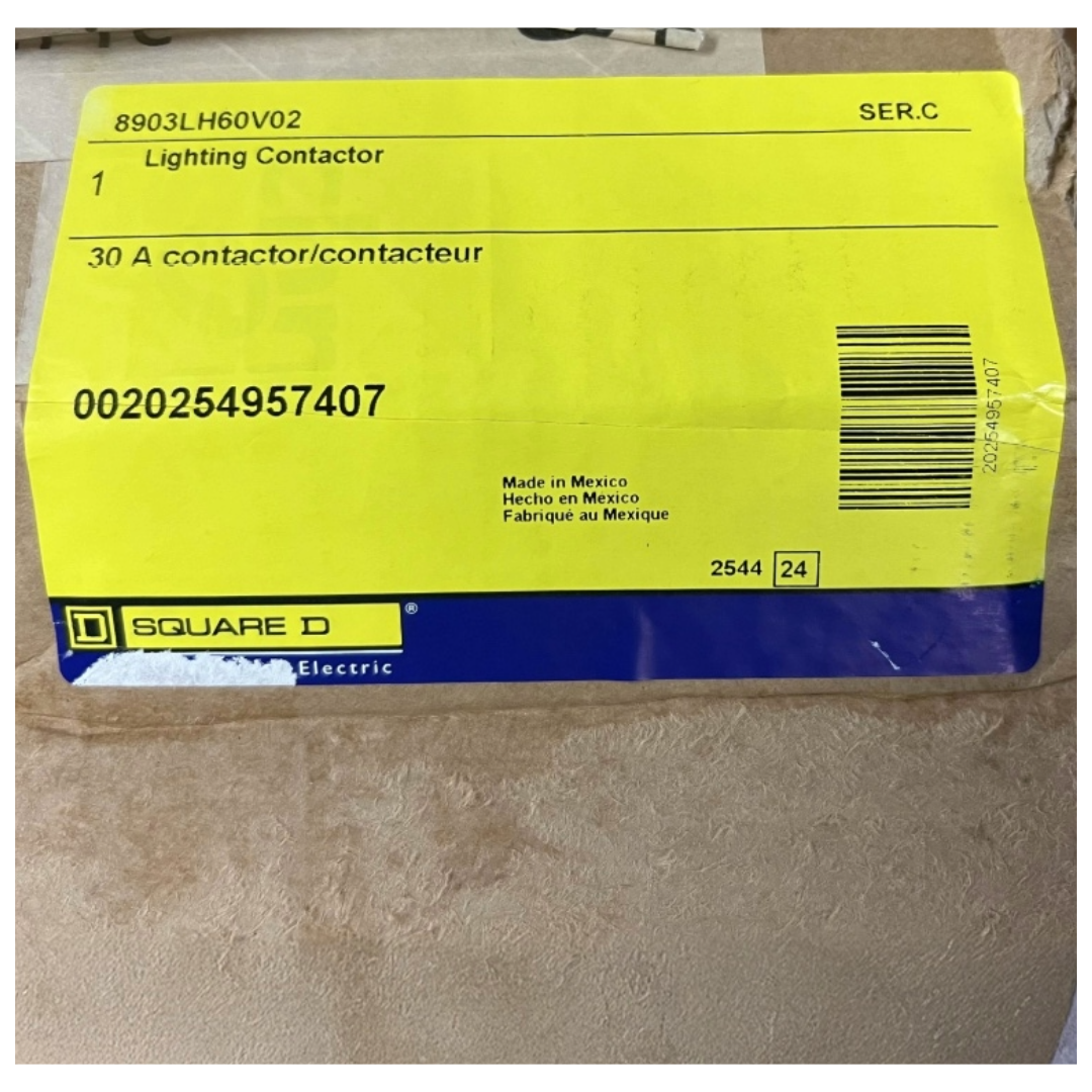 Yellow and blue label with text and a barcode on a cardboard background