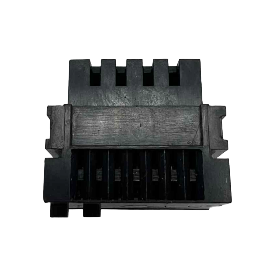 Black plastic component with grooved design on a white background