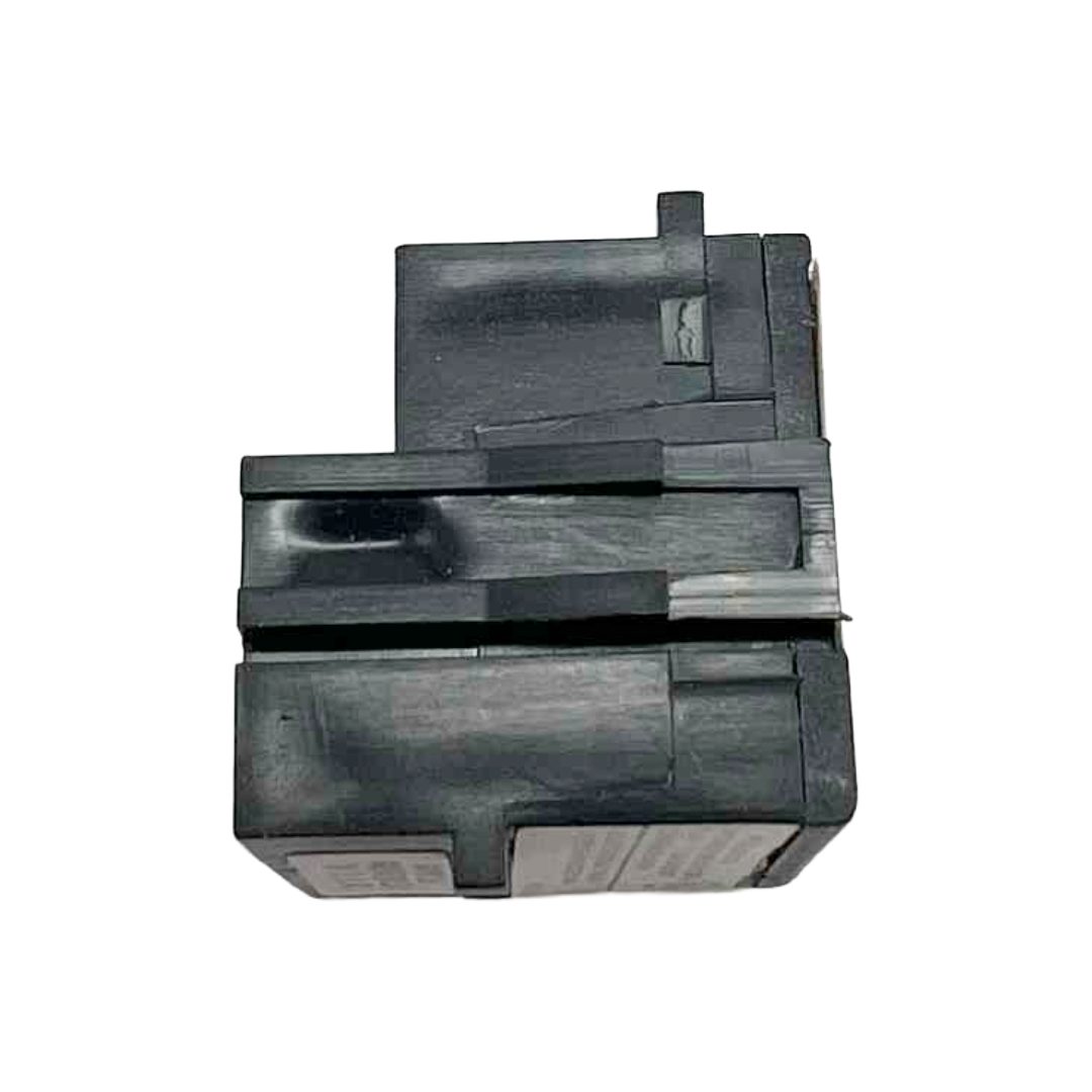 Black plastic component on a white background