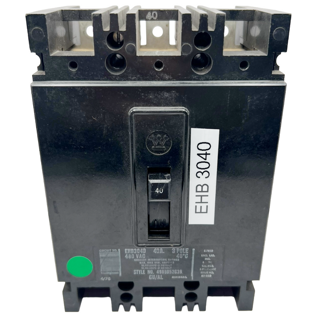 Black electrical circuit breaker with a label on a white background