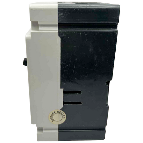 Black and white electronic device with 'Factory Seal' label on a white background