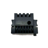 Black plastic component on a white background