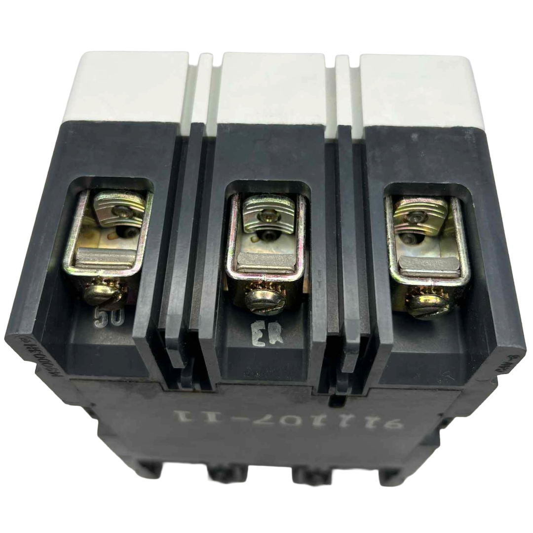 Electrical circuit breaker with three terminals on a white background