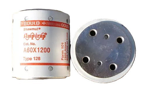 A Gould Shawmut A60X1200 1,200 Amp fuse with its end cap removed, revealing the metallic interior with multiple holes for electrical connection.