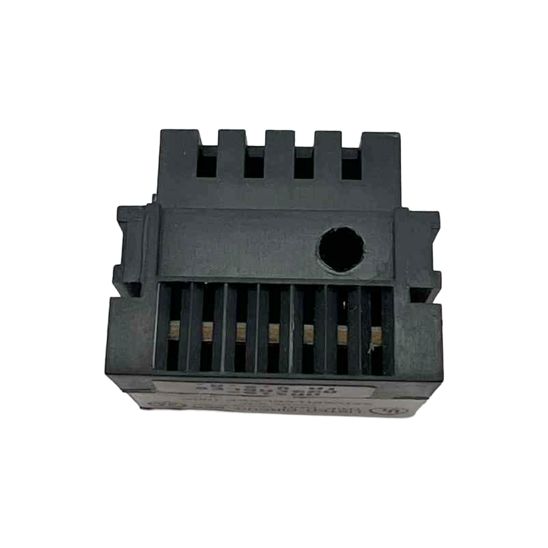 Black plastic component with textured surface on a white background