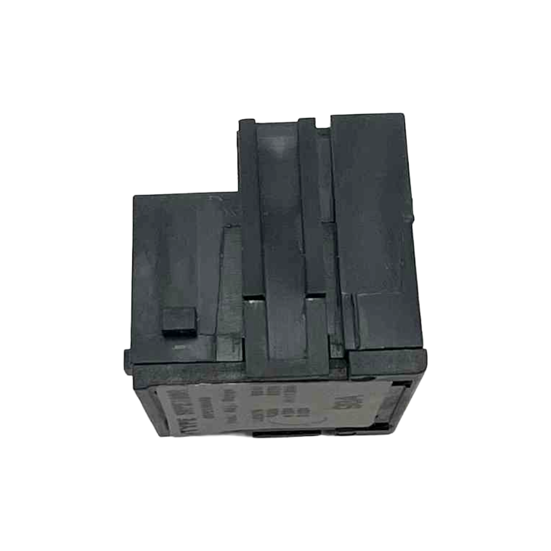 Stack of black plastic components on a white background