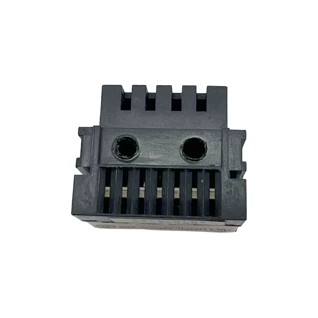 Black plastic component with grooves on a white background