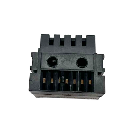 Black plastic component with grooves on a white background
