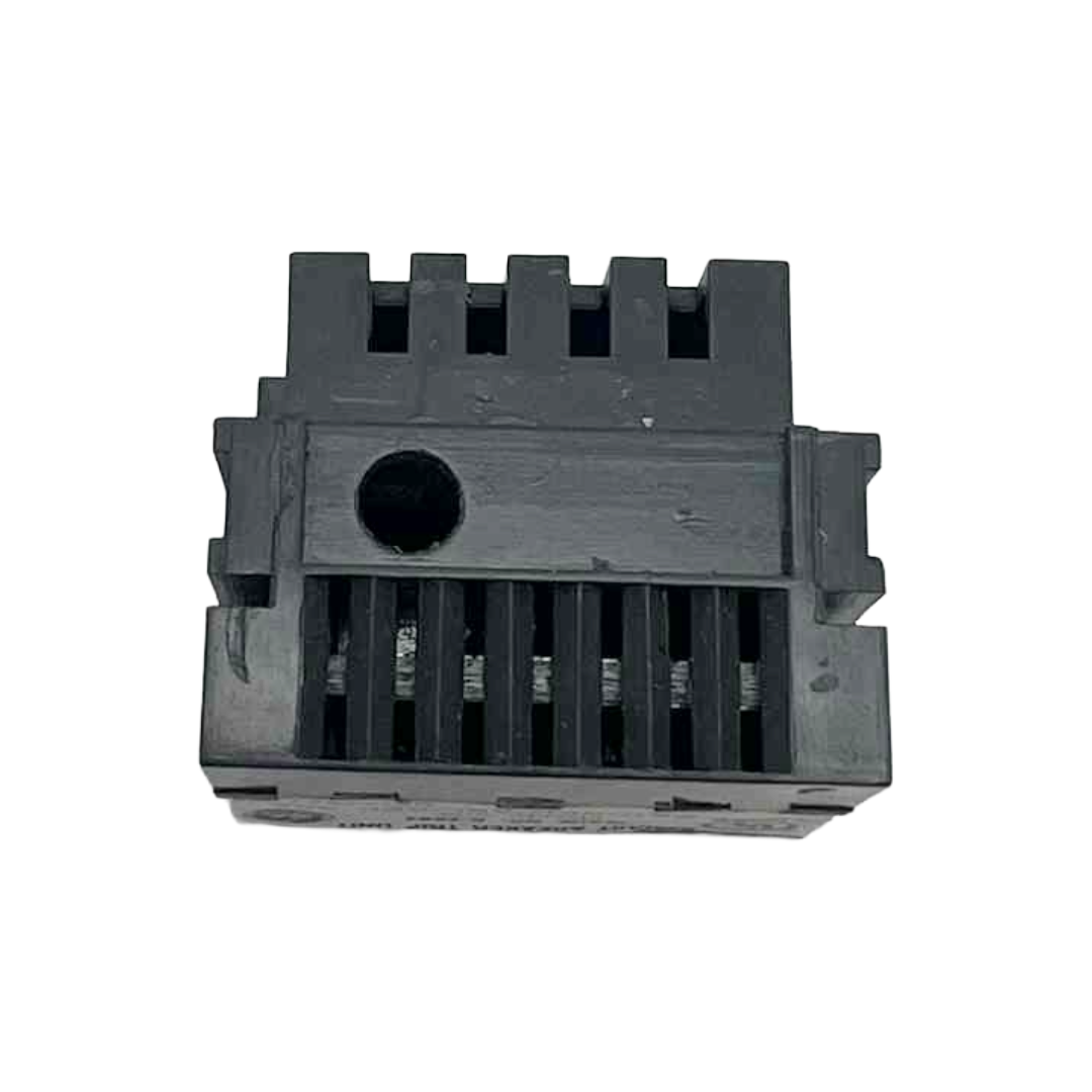 Black plastic component with grooves on a white background