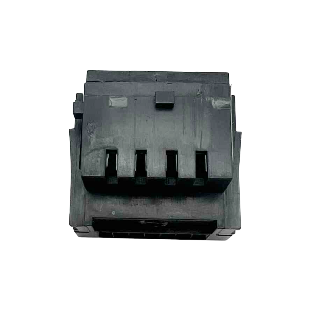 Black plastic component on a white background