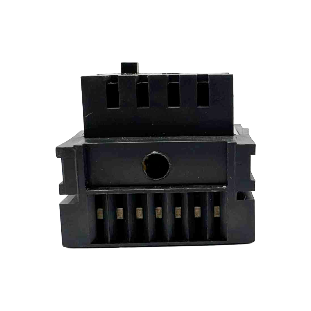 Black plastic component on a white background