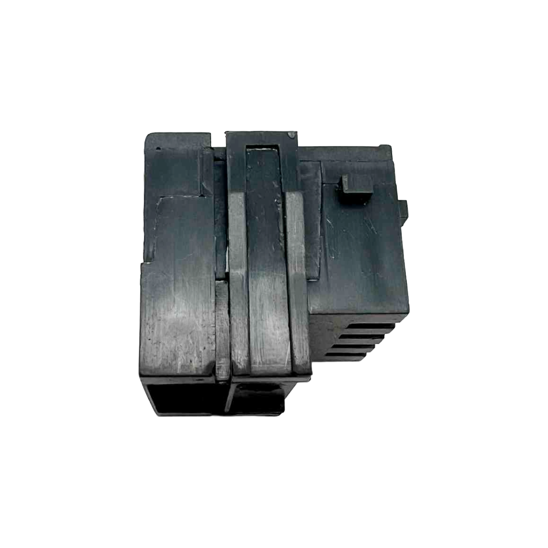 Black plastic component on a white background