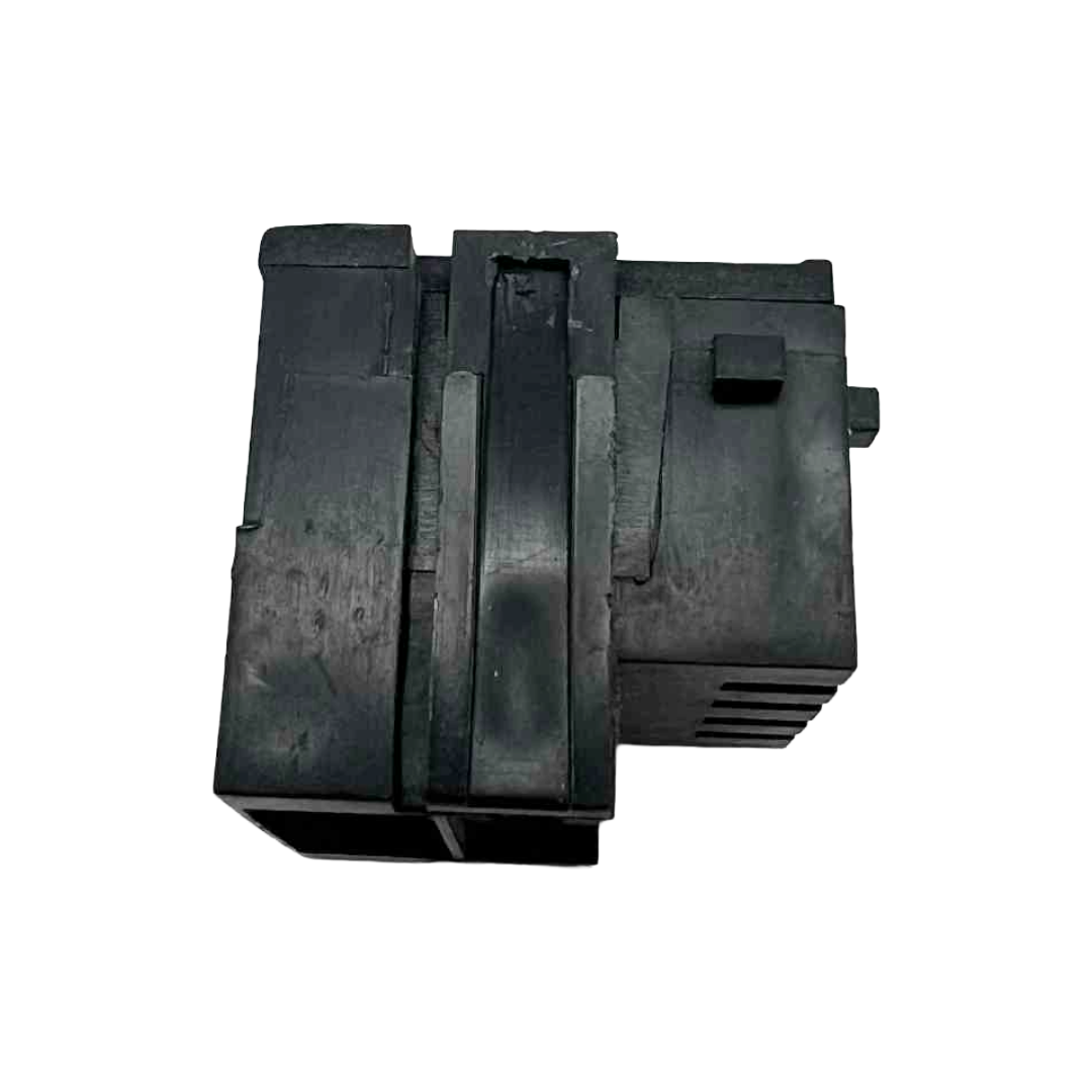 Black plastic component on a white background