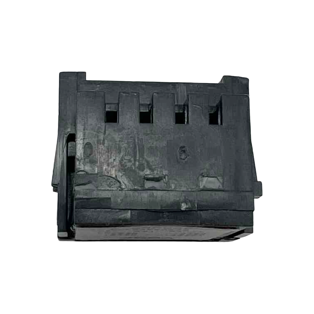 Black plastic component on a white background