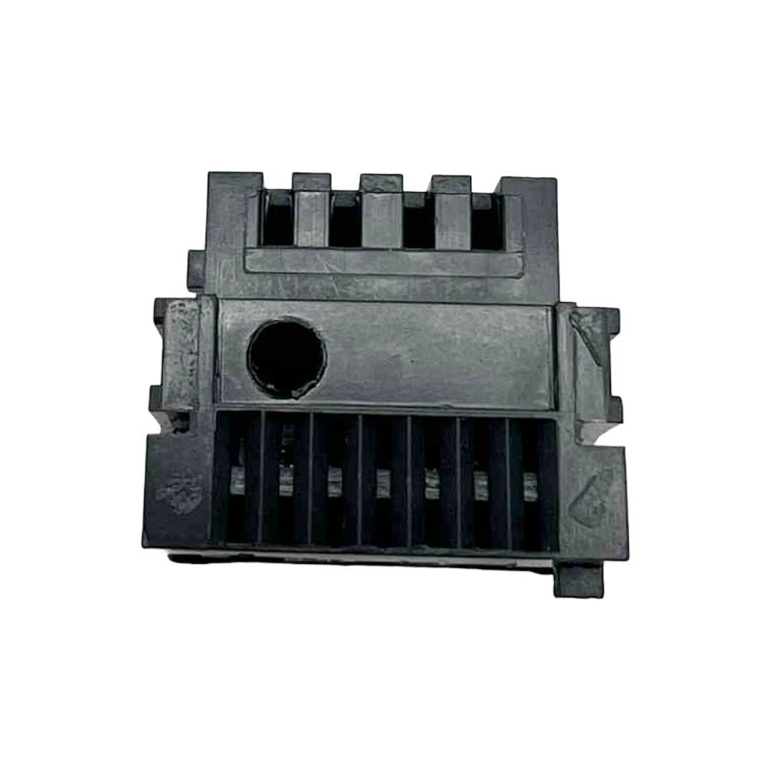 Black plastic component on a white background