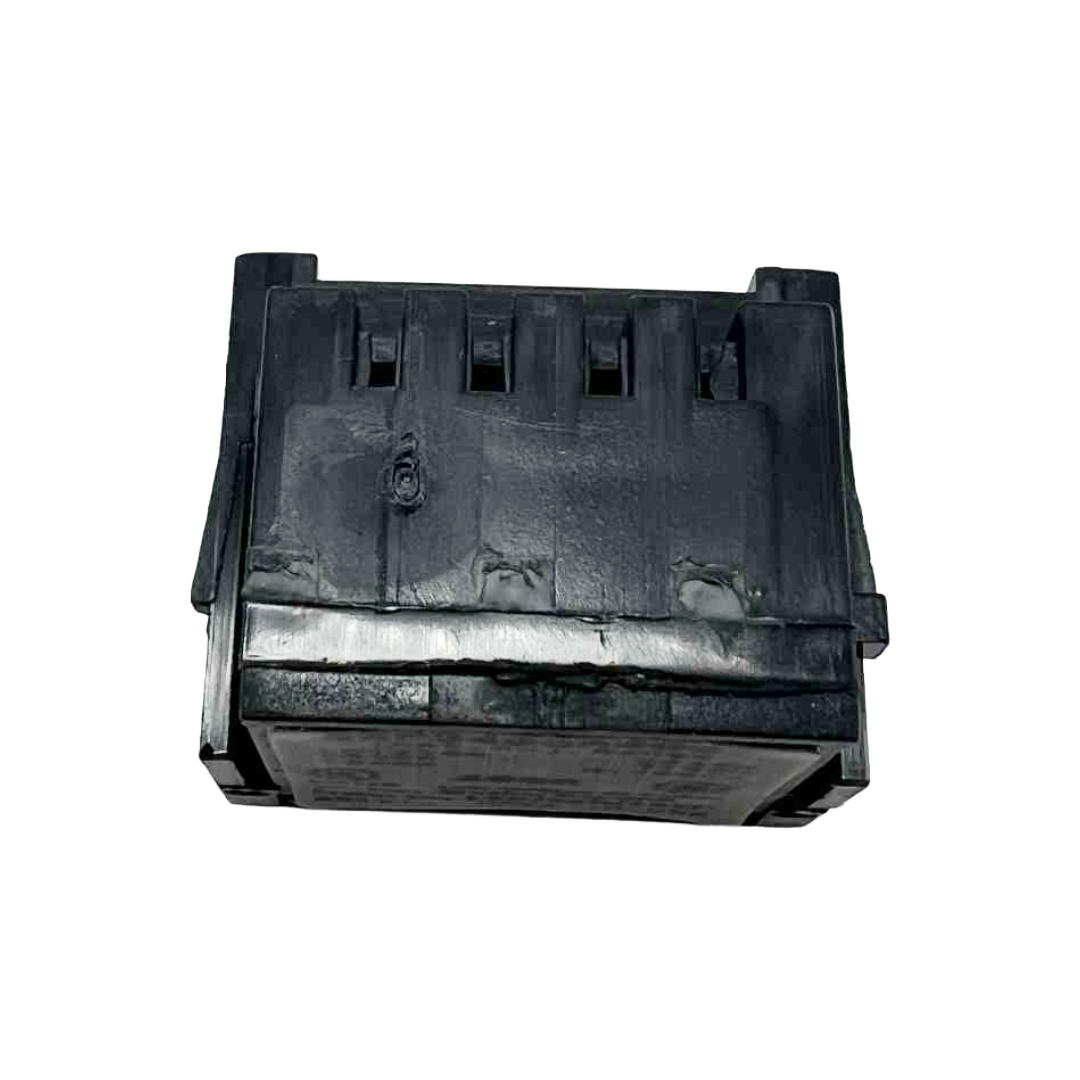 Black plastic component on a white background