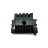 Black plastic component with grooves on a white background