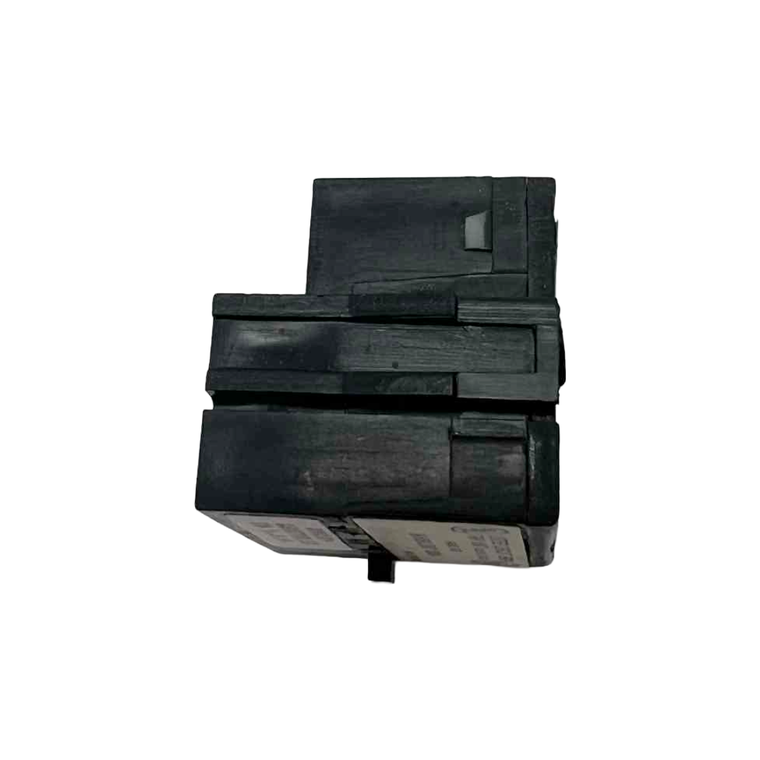 Black electrical breaker trip unit on a white background