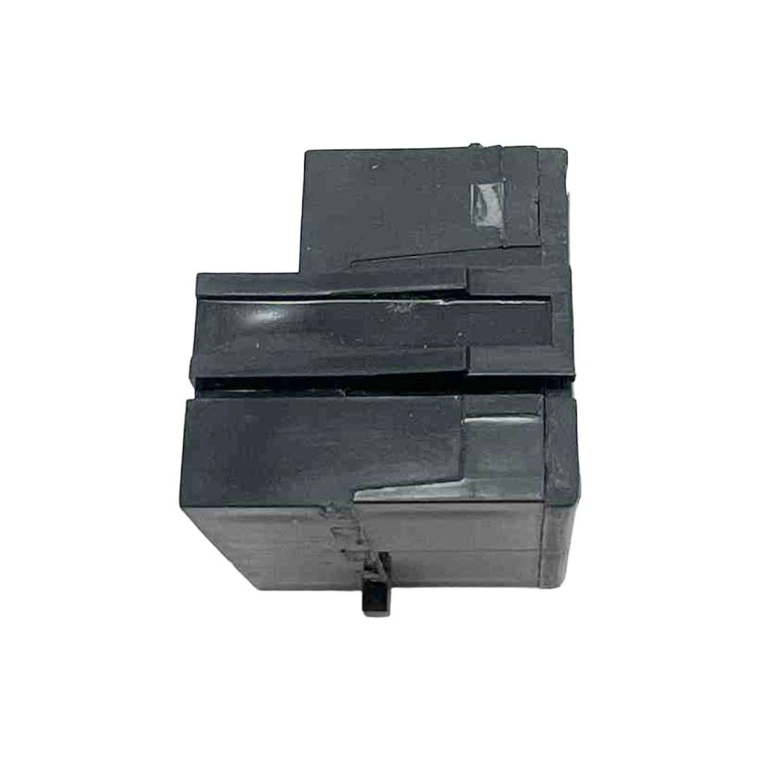 Black plastic component on a white background