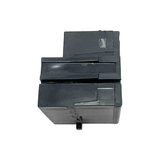 Black plastic component on a white background
