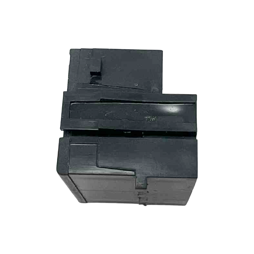 Black plastic component on a white background