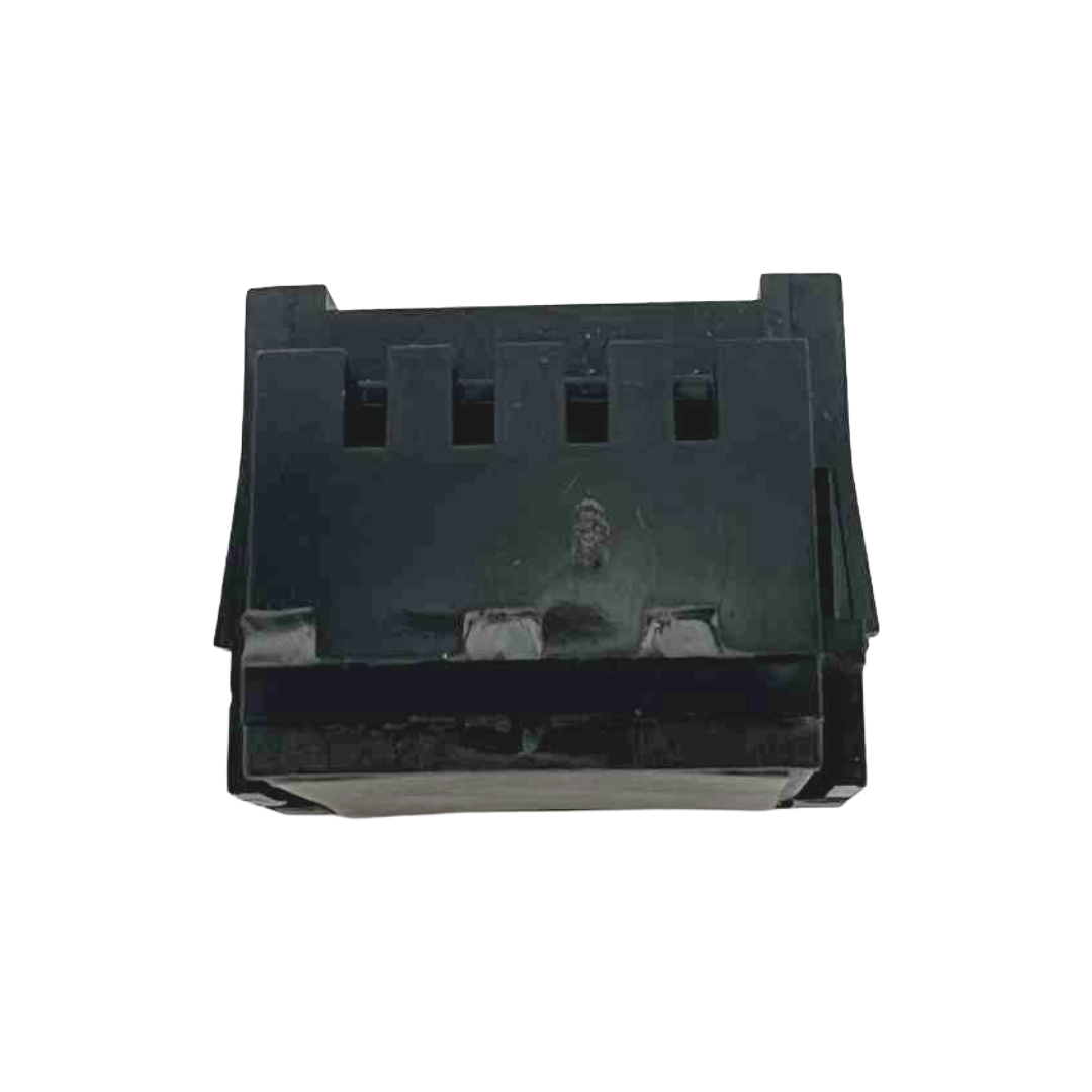 Black plastic component on a white background