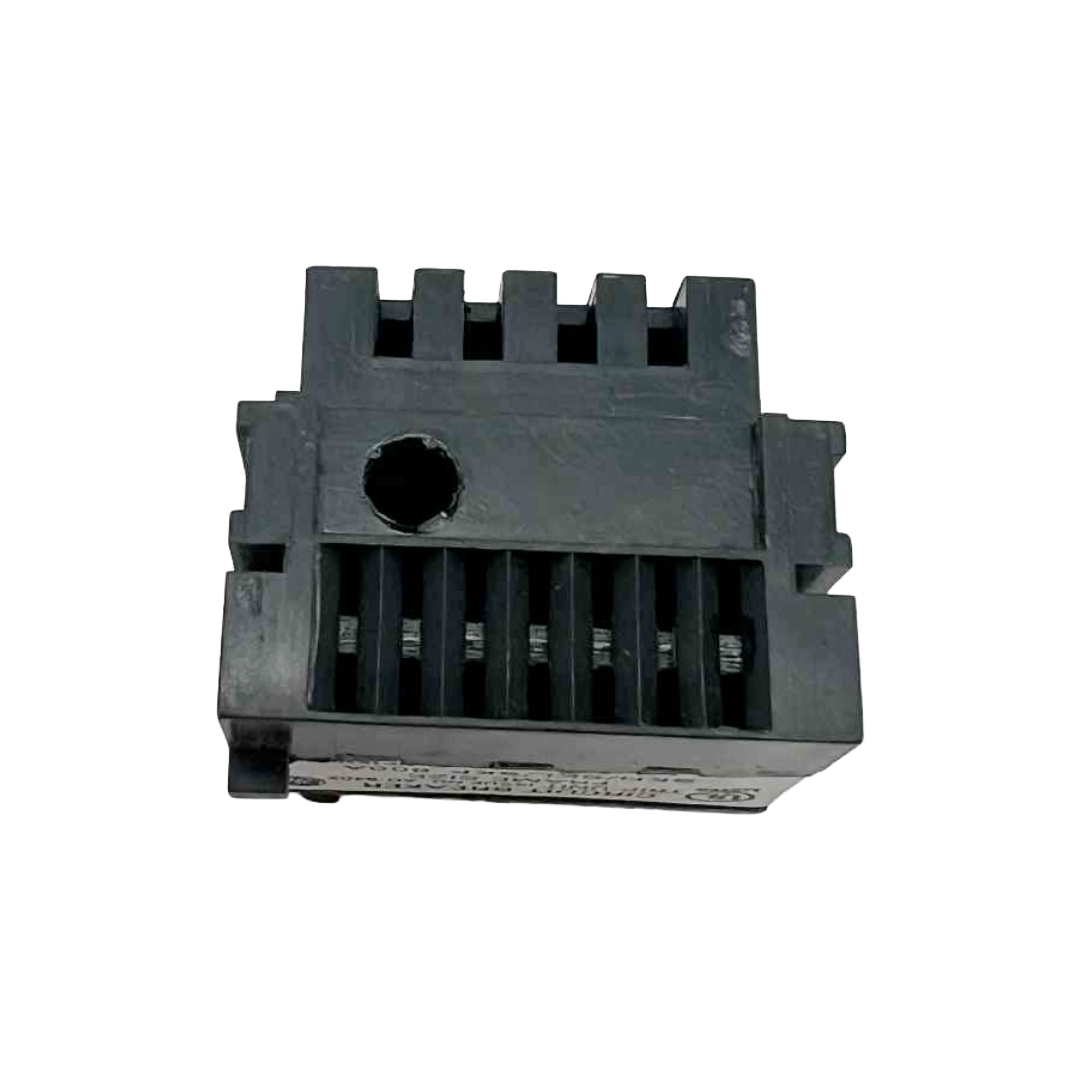 Black plastic component with grooves on a white background