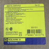 Yellow label with text and Square D logo on a gray background