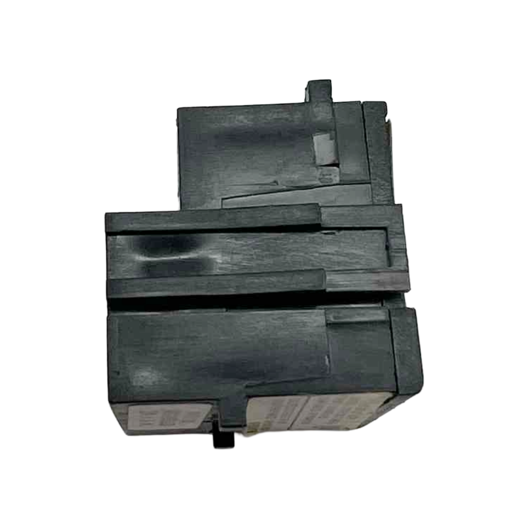 Black plastic component on a white background