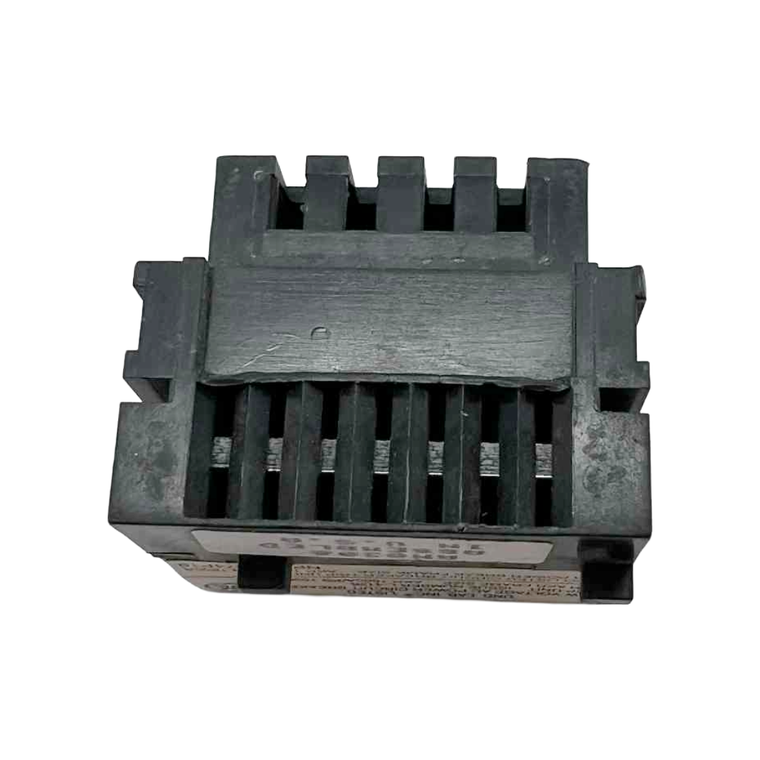 Black plastic component with grooves on a white background