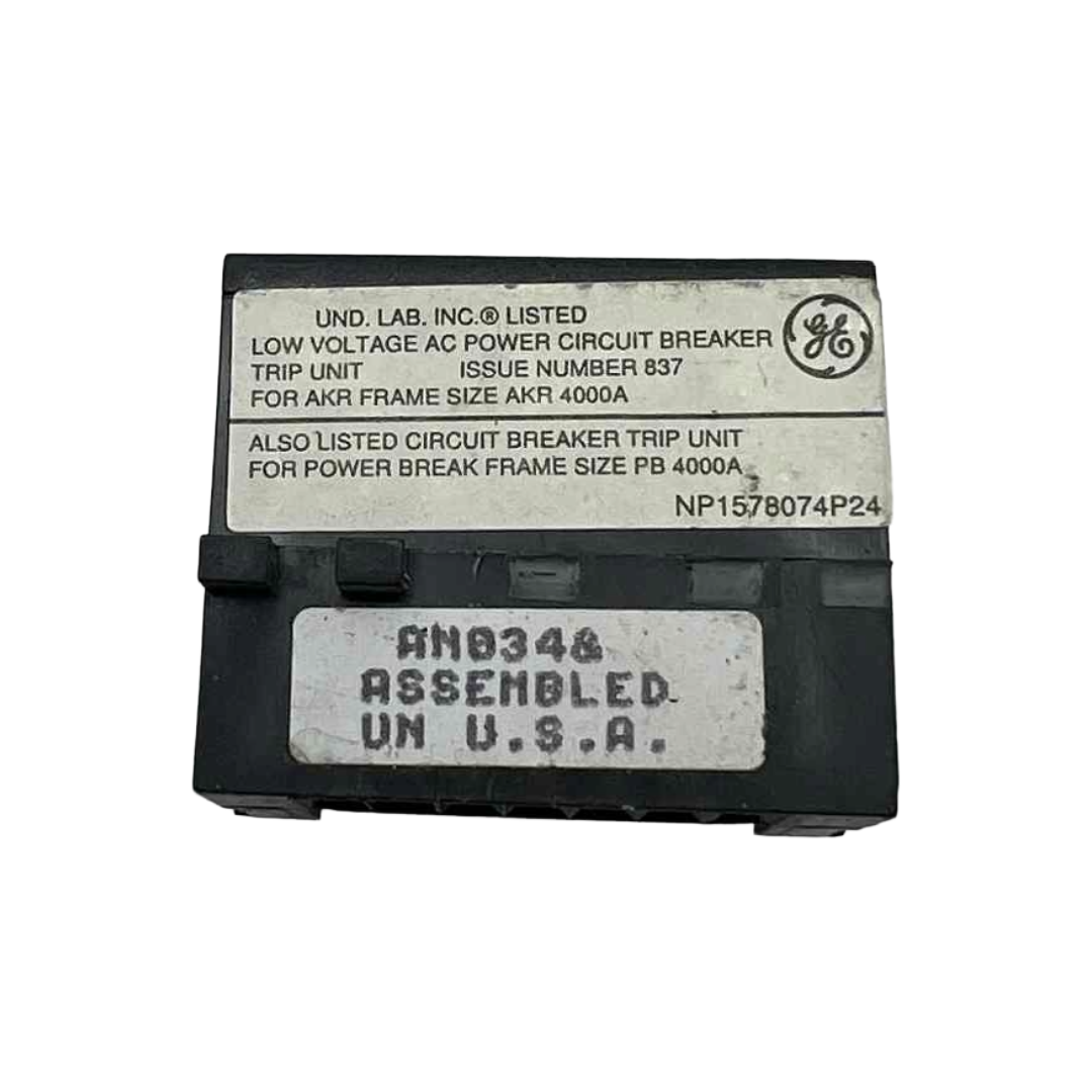 Circuit breaker trip unit with labels and a General Electric logo on a white background