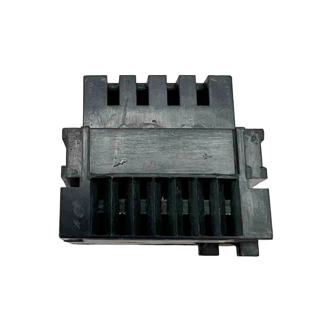 Black plastic component on a white background