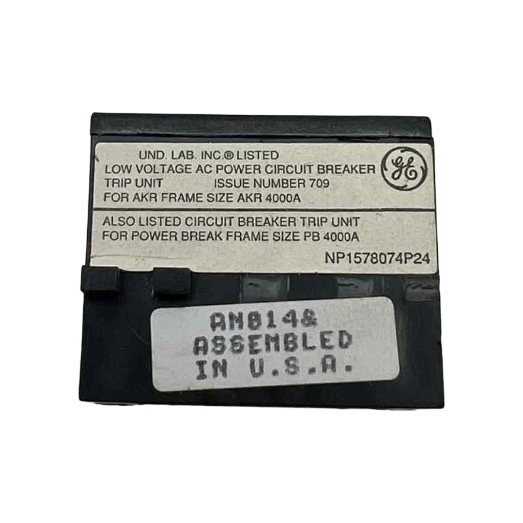 Circuit breaker trip unit with labels and a General Electric logo on a white background