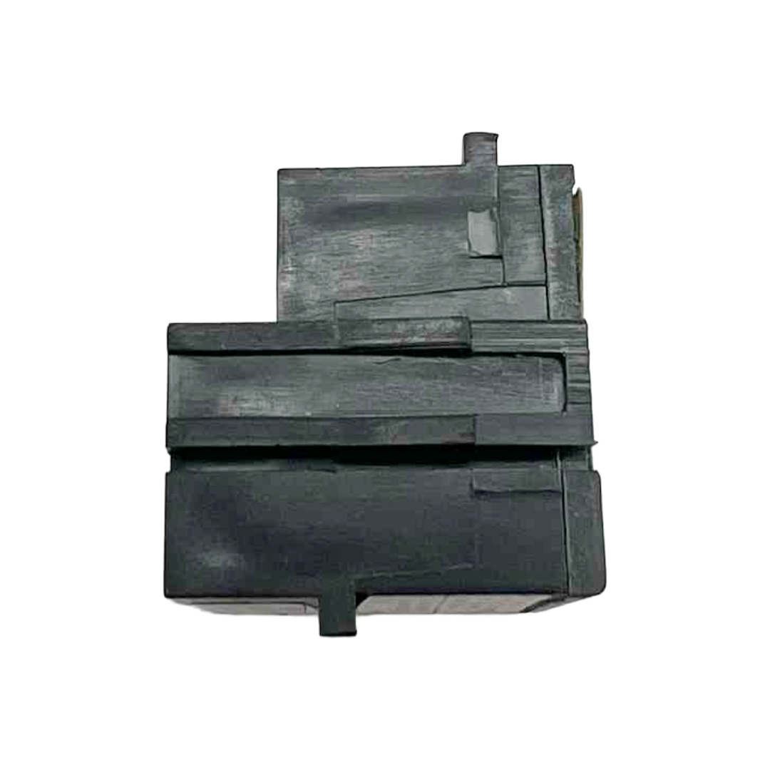 Black plastic component on a white background